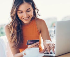 photo of woman using credit card